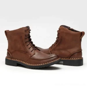 Brown leather steampunk lace-up ankle boots with contrast stitching and thick rubber sole, front flat lay view