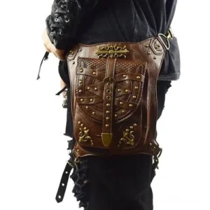Steampunk leather leg holster bag rear left view on male model, showcasing embossed leather surface, brass rivets, and vintage hardware details