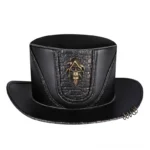 Black leather steampunk top hat with bronze skull emblem and croc-textured panel, frontal studio view