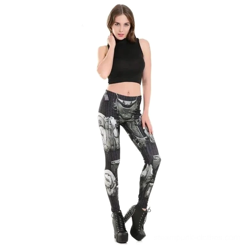 Front full-body shot of steampunk leggings on model in black cropped top, showcasing mechanical print pattern and matching studded platform boots
