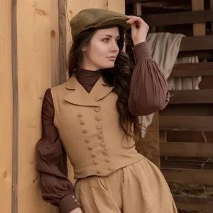 Light tan khaki steampunk women's waistcoat paired with puff sleeve blouse and newsboy cap, three-quarter body view showing tailored double-breasted design and architectural silhouette