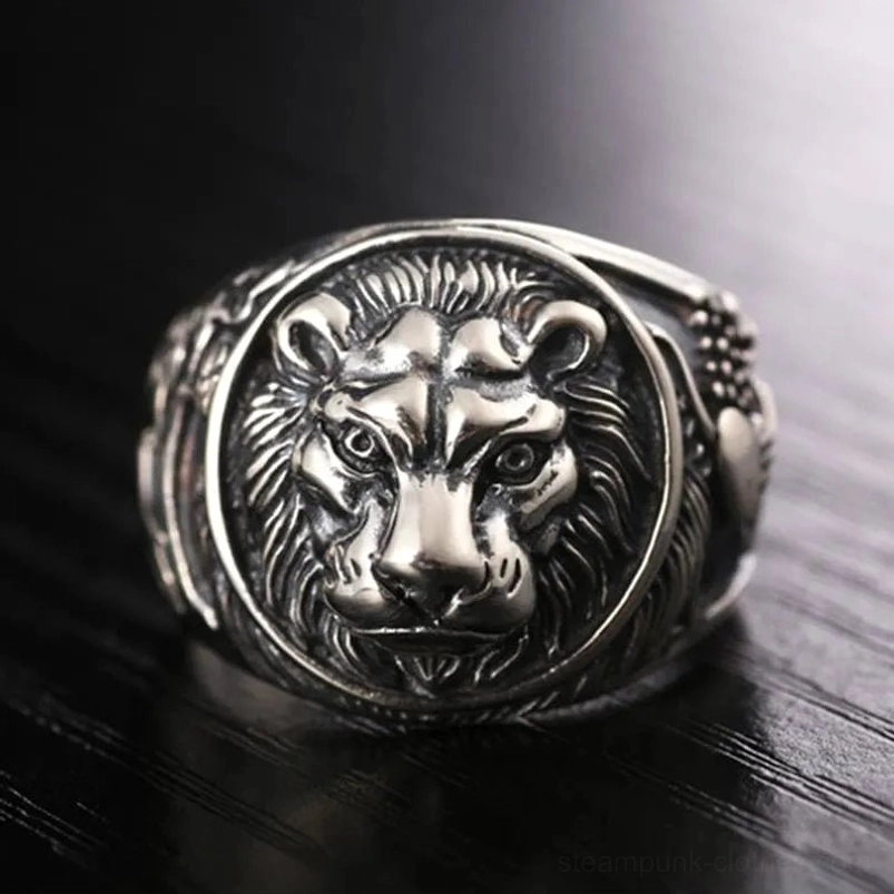Steampunk silver lion ring close-up frontal view - embossed lion face on textured vintage sterling silver band