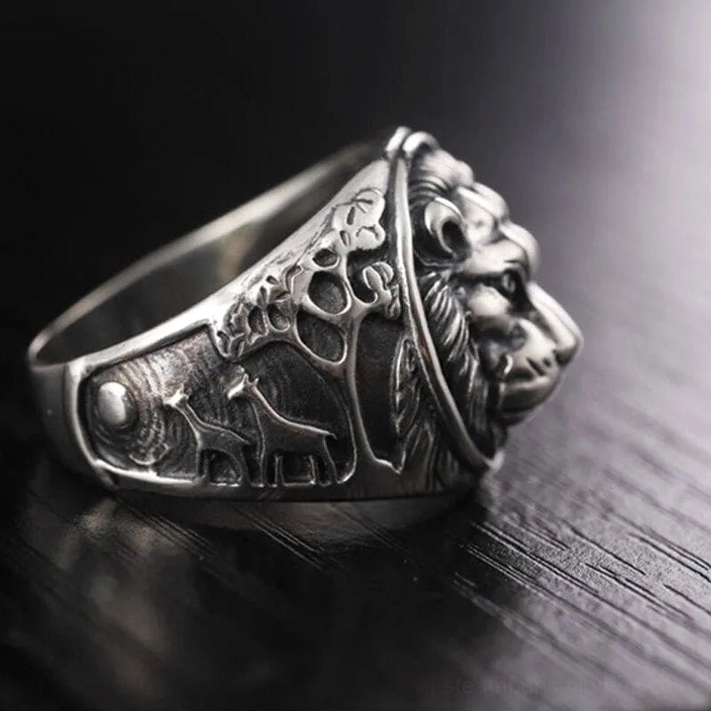 Steampunk lion ring profile view with jungle-themed side carvings - antique silver tone signet style