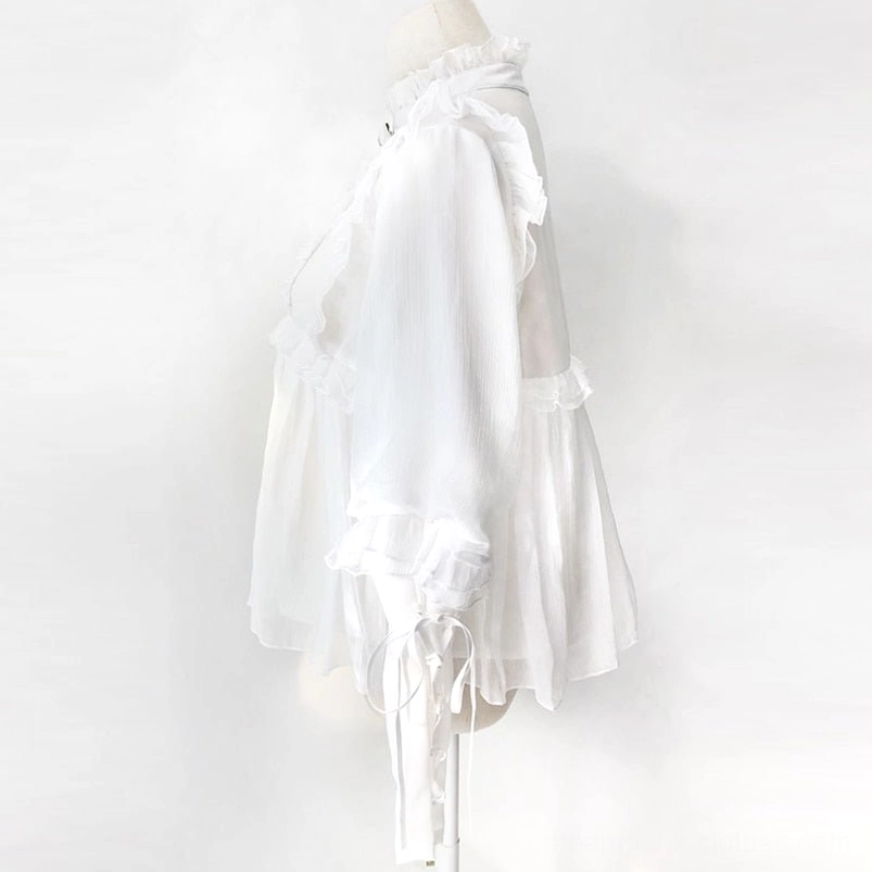 Lolita steampunk blouse detail shot of decorative bow brooch, ruffled collar trim and semi-sheer chiffon construction