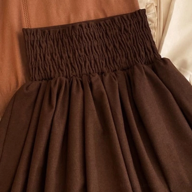Close-up detail of steampunk lolita skirt waistband showing shirred elastic construction and triple vintage square buckle decorations