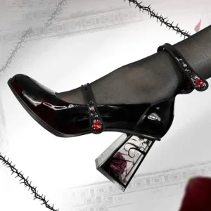 Side profile of preserved rose Gothic Mary Jane heels showcasing transparent block heel with encased black rose, crimson gemstone buckle, and wine-red gradient toe detail on patent leather