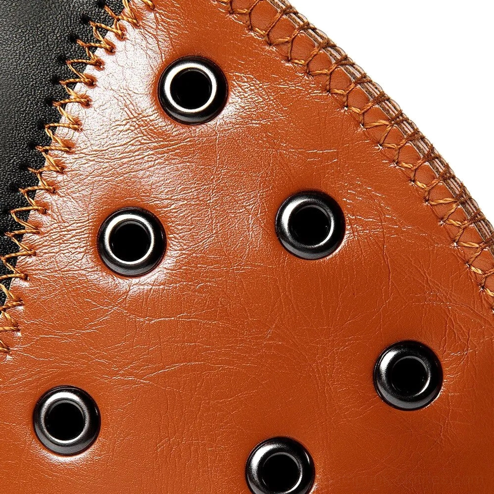 Detailed flat view of brown faux leather material with metal eyelets and contrasting tan thread stitching demonstrating craftsmanship