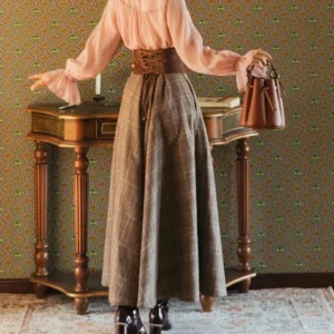 Brown glen plaid steampunk skirt back view showing waist sash detail and flowy floor-length silhouette