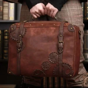 Steampunk leather messenger bag with vintage brass gears and metal hardware worn by person in plaid trousers, library setting showcasing retro-futuristic school bag style