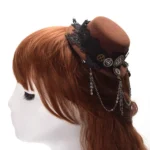Steampunk mini fedora hat side view on mannequin with brown felt, black lace band, metal gears and hanging chain ornaments