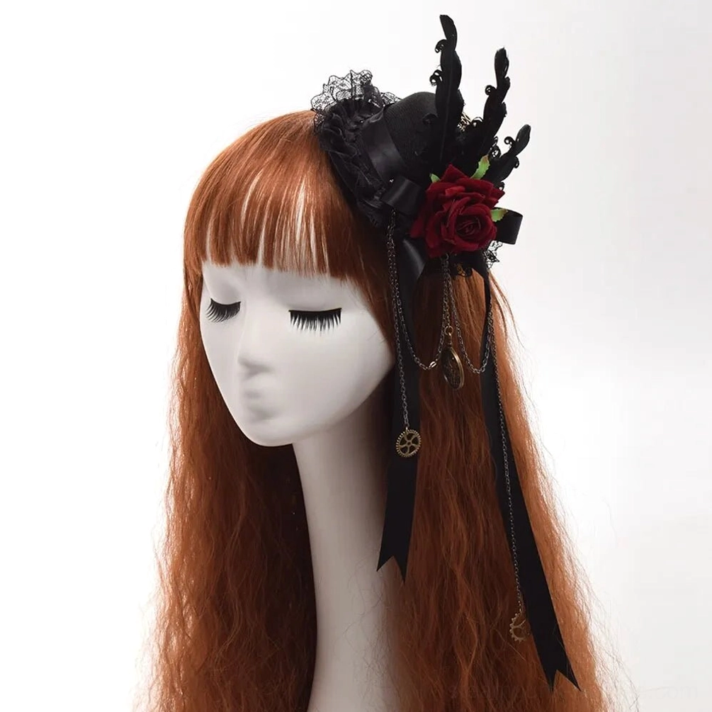 Gothic steampunk mini top hat with black lace, burgundy velvet rose, vintage metal gear charms, black feathers and satin ribbons on mannequin with auburn wavy wig