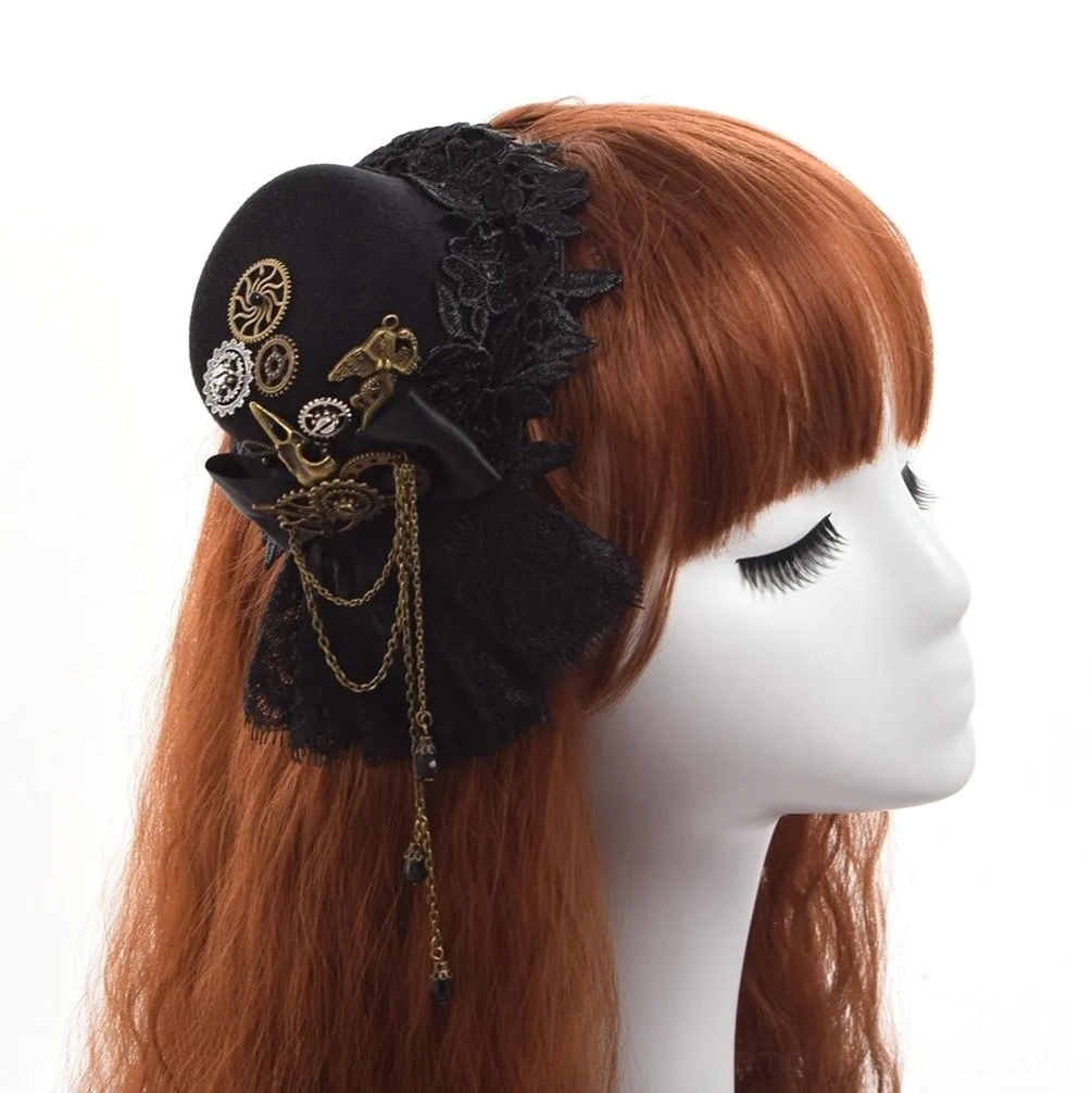 Steampunk mini top hat with black lace and vintage gear tassel worn on mannequin head, showing right side profile view with auburn long hair background