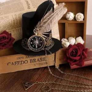 Steampunk mini top hat featuring dual feathers, brass compass and metal chain trim positioned over antique book and rose decoration