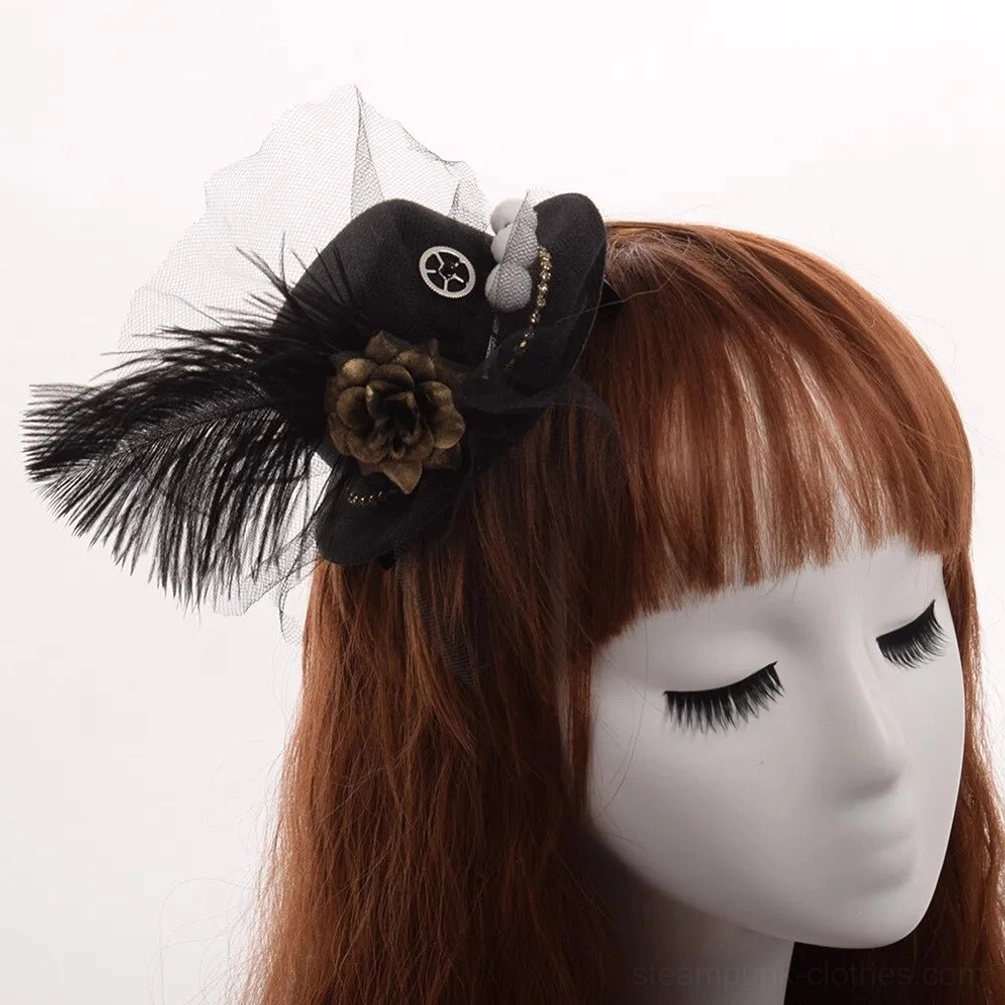 Black steampunk mini top hat with feather and tulle on female mannequin, left side front view showcasing gothic fascinator with vintage flower decor