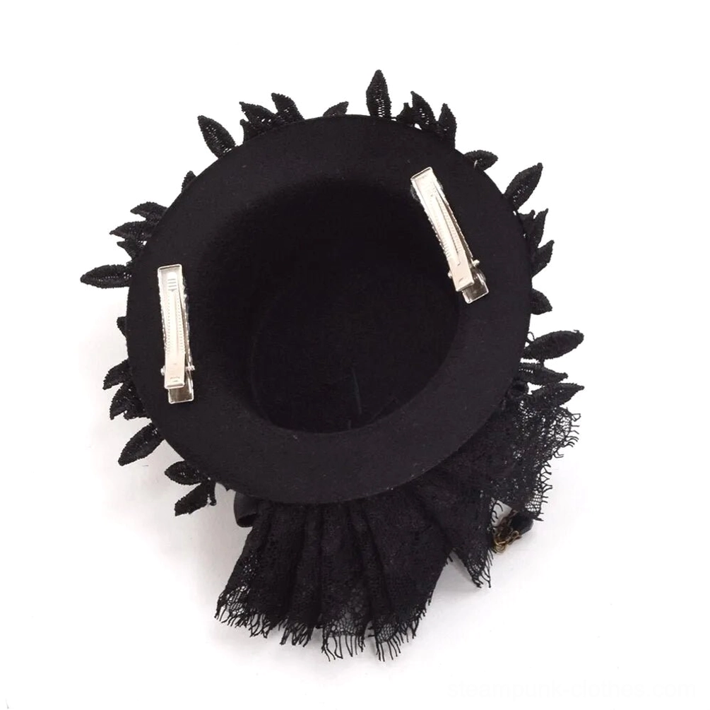 Steampunk mini top hat interior top view showing dual hair clips and frayed black lace edge on felt hat base