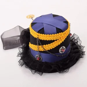 Overhead top-down view of steampunk mini hat displaying double yellow braided trim, ruffled lace brim, metal chain accents and gem decorations from above