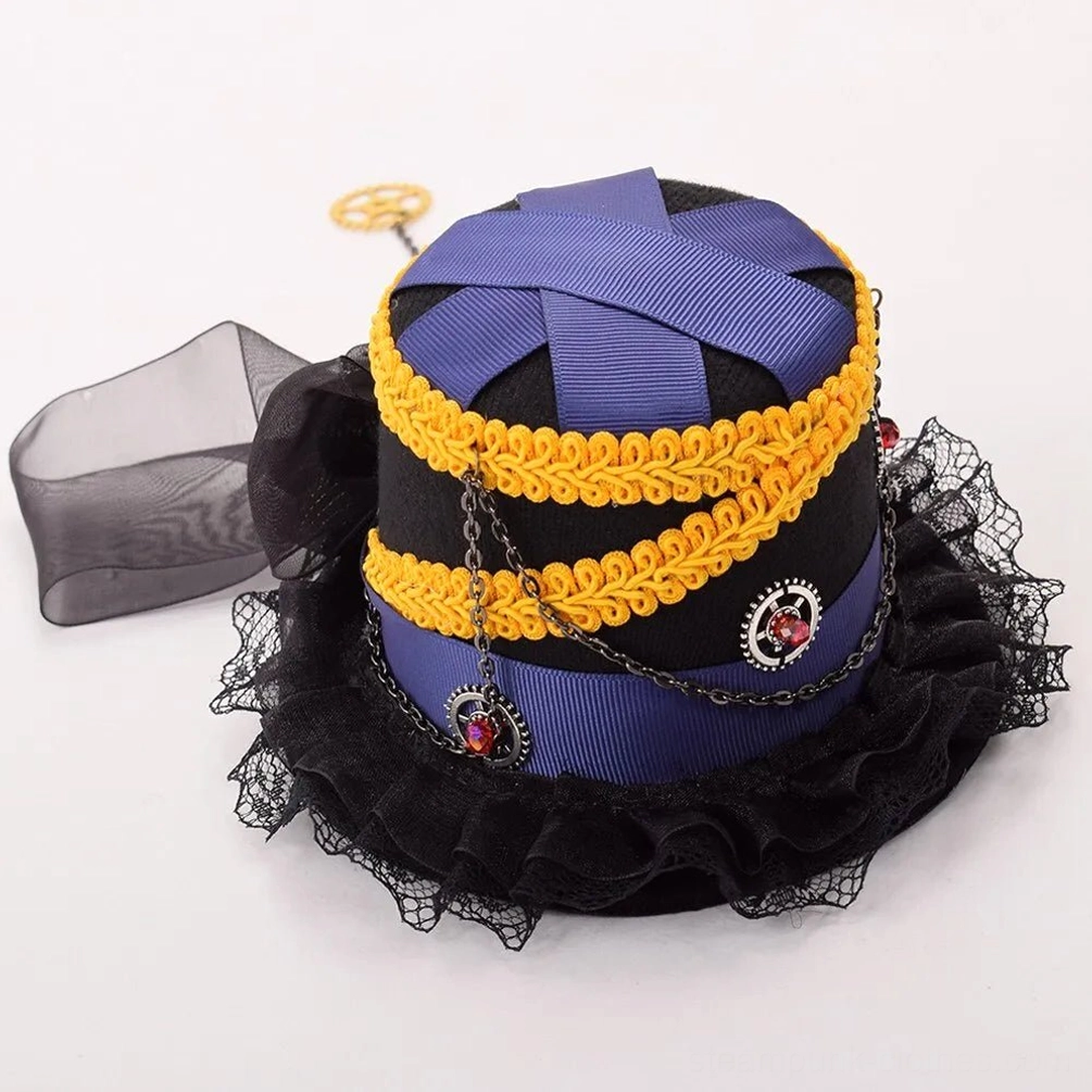 Overhead top-down view of steampunk mini hat displaying double yellow braided trim, ruffled lace brim, metal chain accents and gem decorations from above