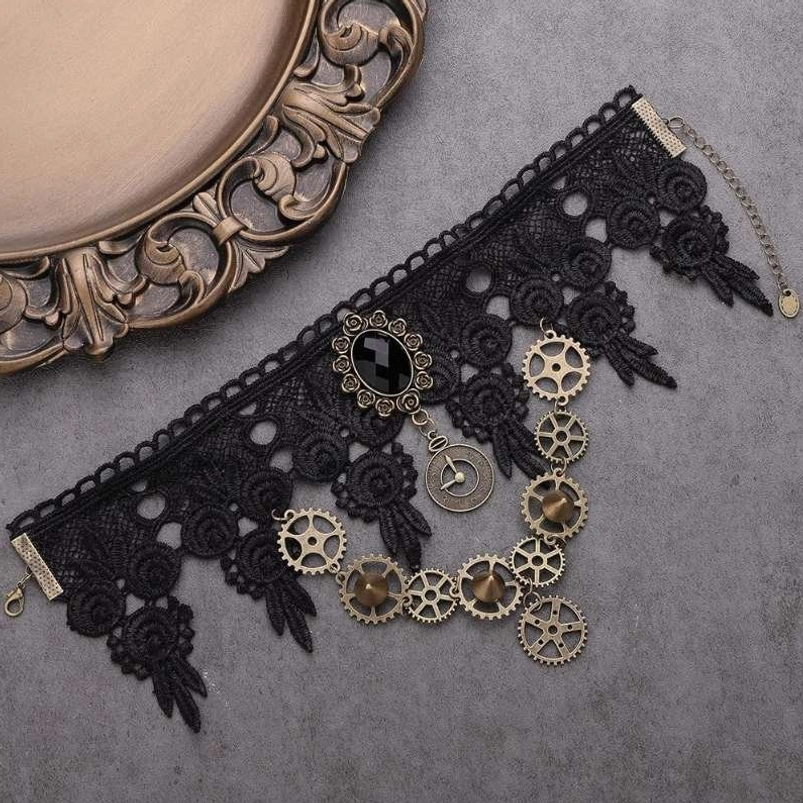 Flat lay photograph of steampunk lace choker with silver-toned brass gears, adjustable extension chain, and vintage aesthetic on grey fabric background