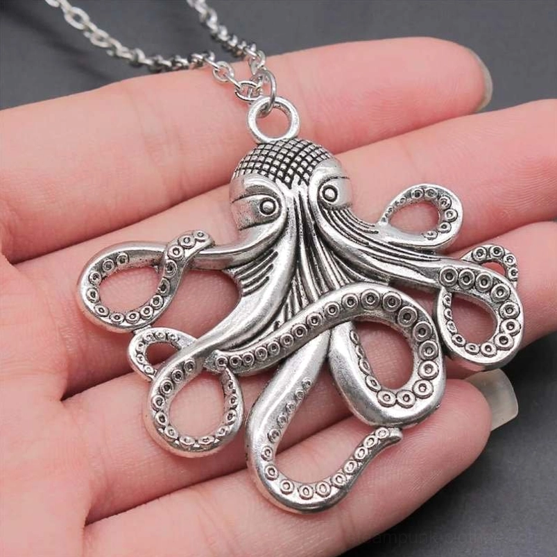 Silver tone steampunk octopus kraken necklace pendant close-up overhead showing clear suction cup patterns and silver chain