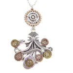 Steampunk octopus necklace pendant front view with mixed silver bronze and gold metal tones, featuring integrated gear embellishments and textured finish on white background
