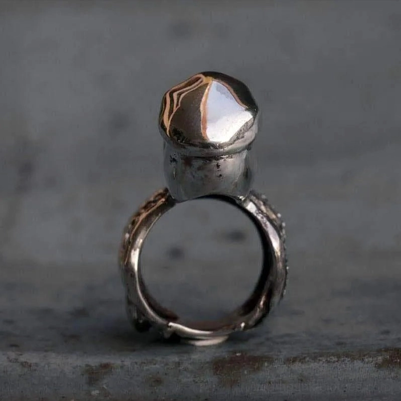 Steampunk octopus ring back view showing polished crown and tentacle band design