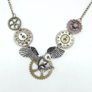 Steampunk statement owl necklace front view showing asymmetrical gear charms, multi-tone metal finish, and central owl pendant on white background