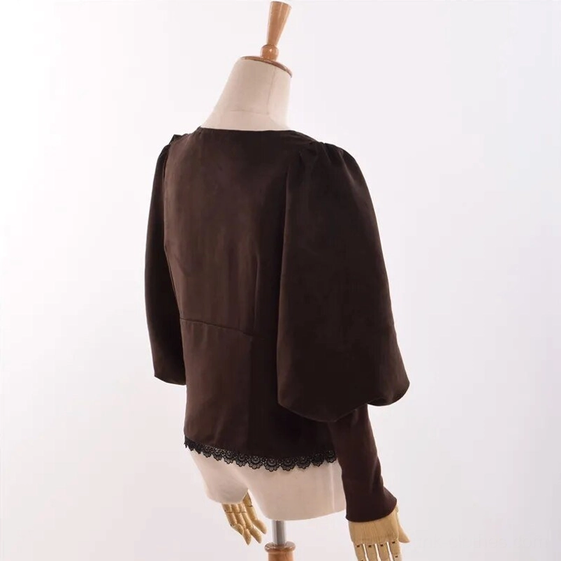 Victorian steampunk blouse back view - brown suedette back seam detail, layered puff sleeves, and lace trim