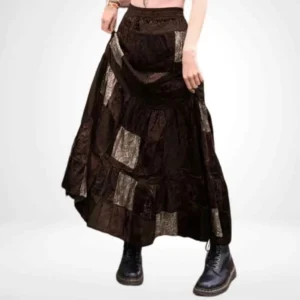 Steampunk patchwork maxi skirt front view with dark brown velvet and paisley print patches, tiered ruffled hem, modeled by female in studio setting