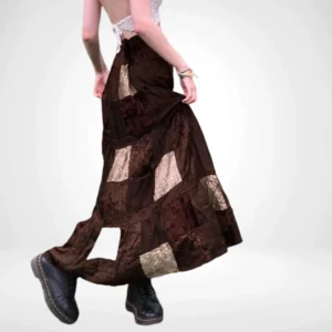 Steampunk patchwork maxi skirt rear three-quarter view showing floor-length flowy silhouette with paisley print fabric panels and tiered construction