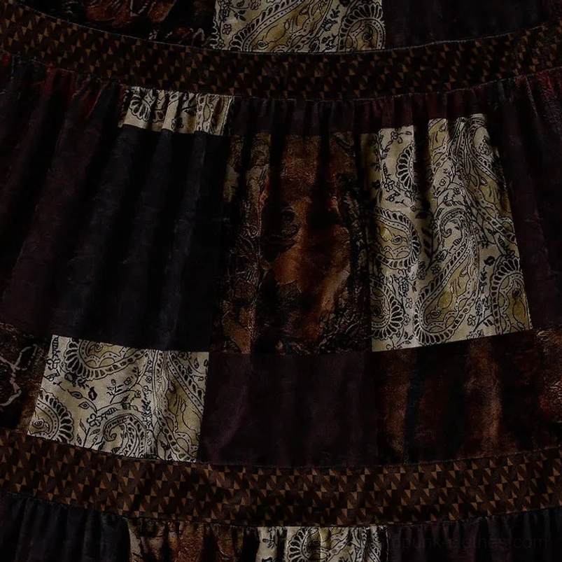 Close-up detail of steampunk patchwork skirt fabric showing mixed velvet and printed paisley patches with tiered trim bands construction