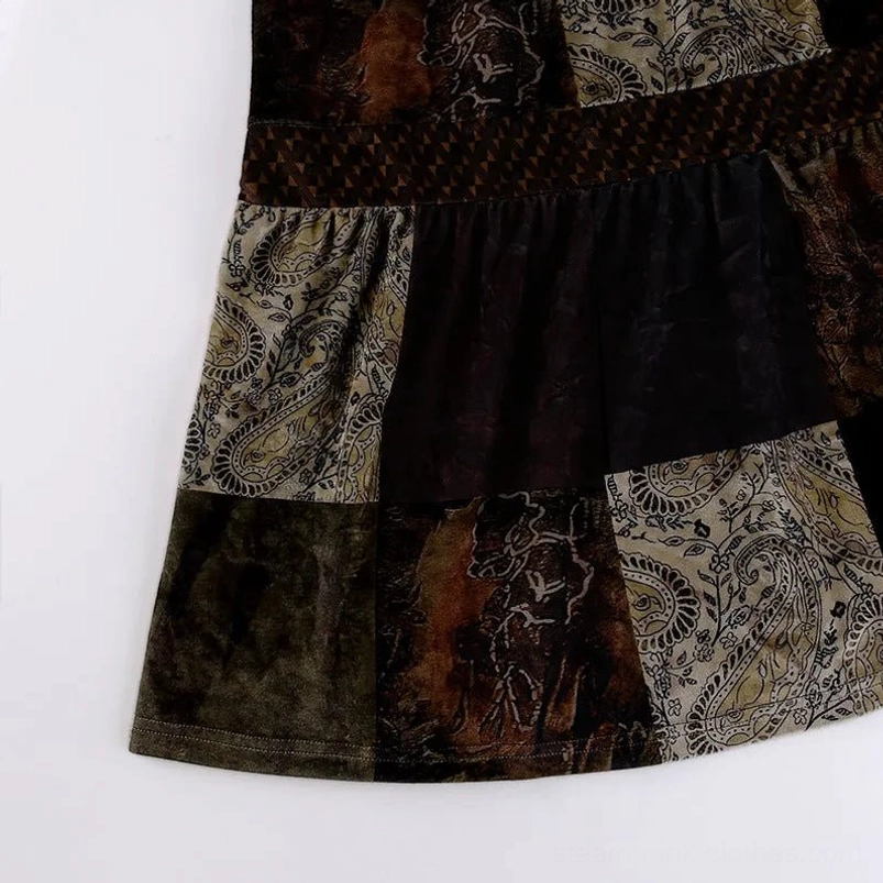 Tiered panel close-up of steampunk patchwork skirt displaying paisley and solid velvet patches with geometric woven trim detailing