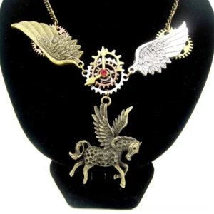 Steampunk Pegasus necklace worn on display bust featuring bronze dual-tone wings, intricate gear accents, and red crystal centerpiece against black velvet background