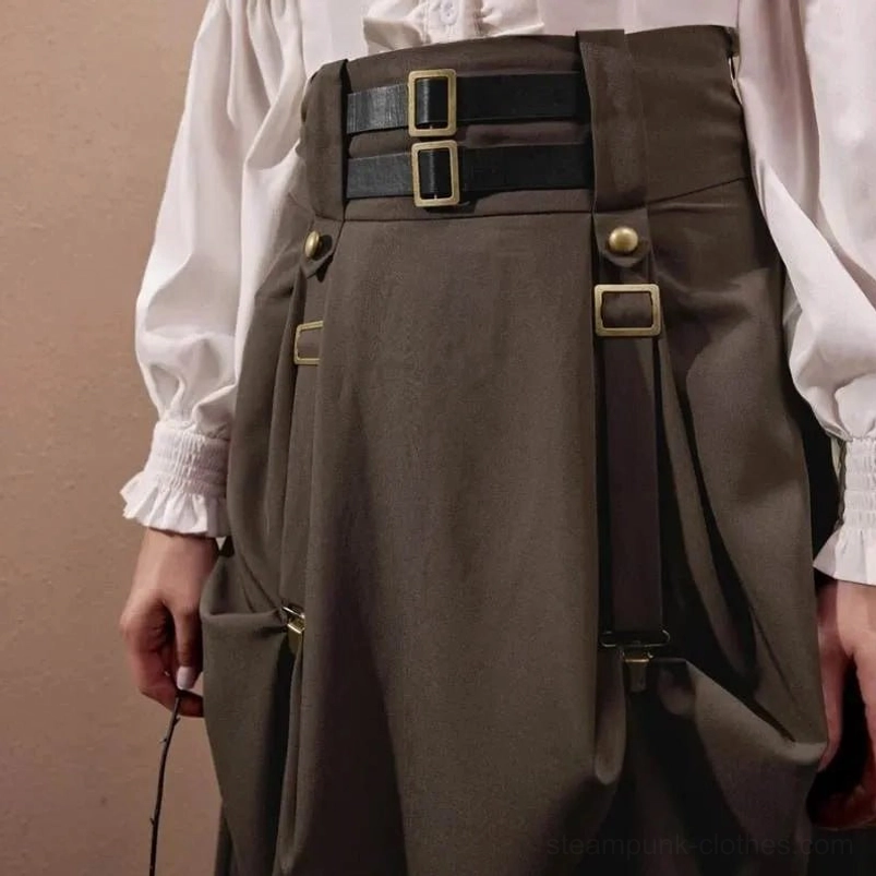 Close-up of steampunk pirate skirt waist showing leather straps, bronze buckles, and functional draped side pockets on model