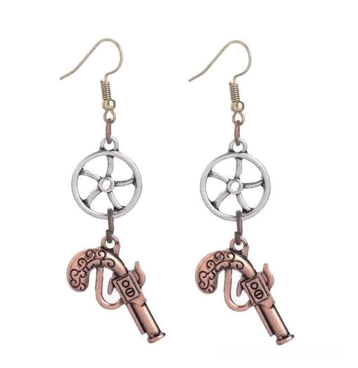 Antique copper plated steampunk gun earrings flat lay, featuring copper-toned fishhooks with gold ship wheel and copper pistol charms