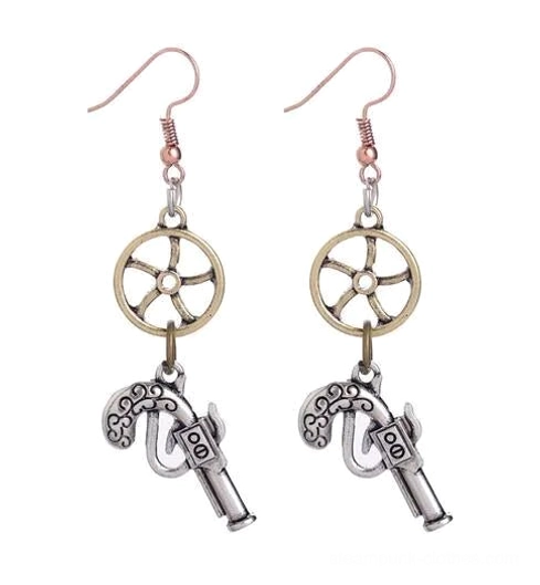 Antique silver plated steampunk pistol and steering wheel earrings flat lay, displaying silver fishhooks with silver ship wheel and silver gun charms