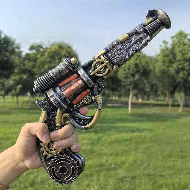 steampunk prop pistol with exposed gears and brass details held in male hands outdoors with grassland background