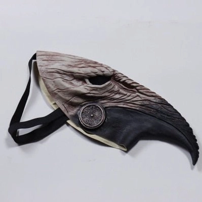 Flat lay top-down angled view of steampunk plague doctor mask on plain white background, showing elastic wearing strap, two-tone brown-black finish, and detailed textured beak construction