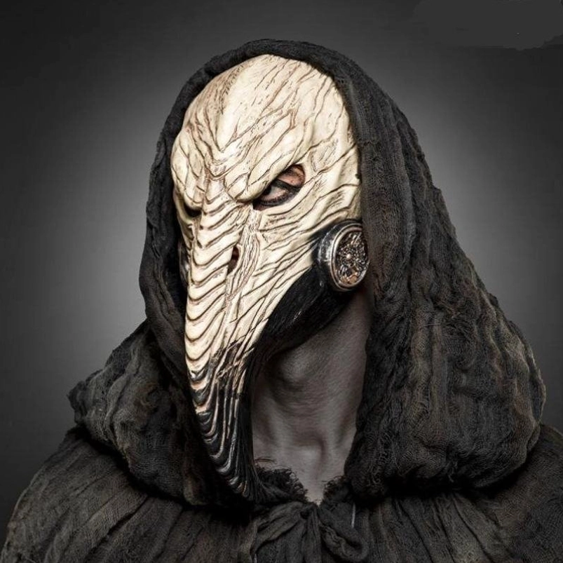 Front view of steampunk plague doctor mask featuring carved bone beak, single eye slit design, and embossed metal side filter on dark studio background