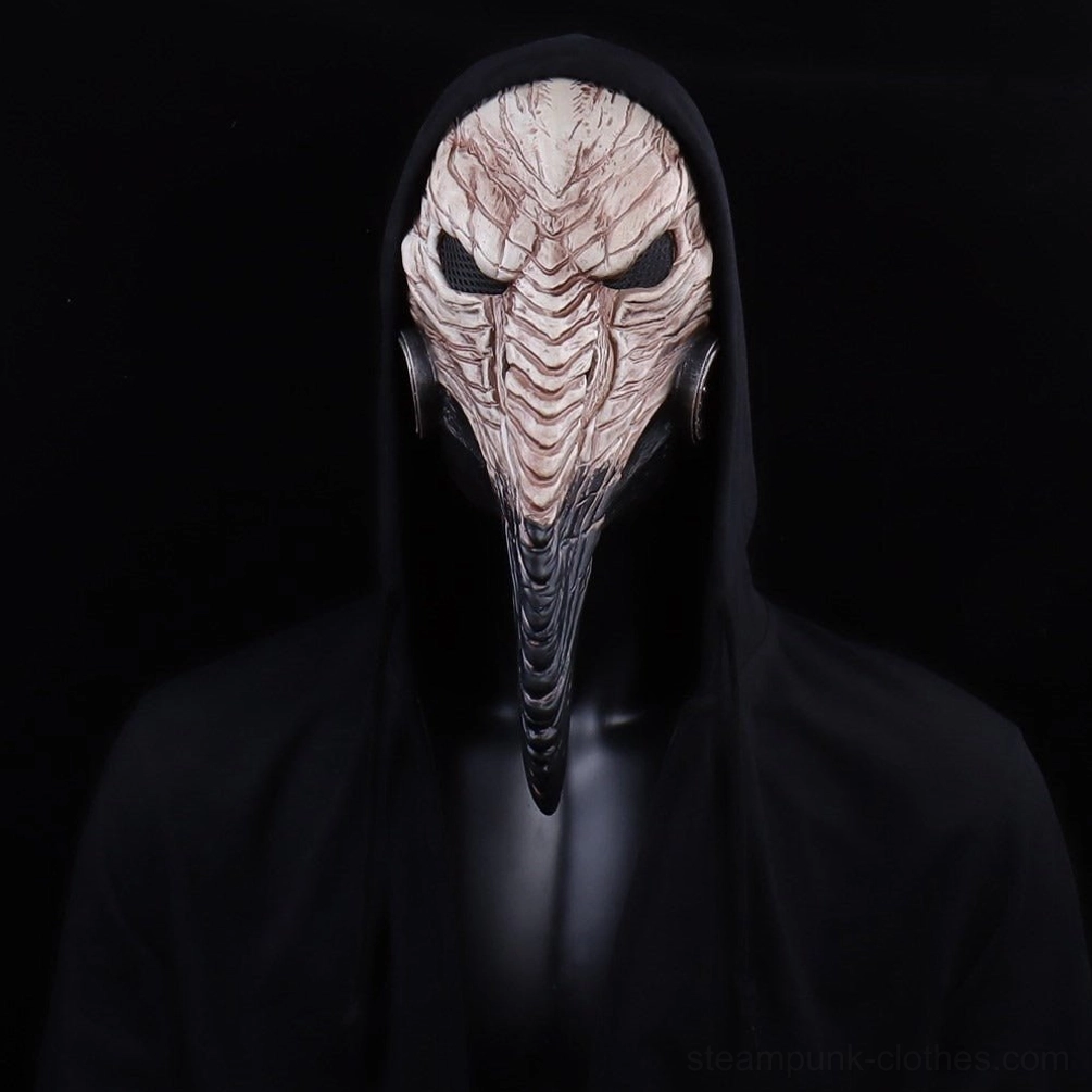 Front full-body view of steampunk plague doctor mask on invisible mannequin in black hooded robe against pure black background, displaying long pointed carved beak, twin eye slits, and pale bone color finish