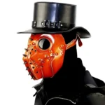 Steampunk plague doctor bird mask left three-quarter view on mannequin with black leather top hat, showcasing brown leather with rivets, spikes and round goggles