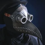 Steampunk raven plague doctor mask in silver finish with adjustable leather strap, distressed metallic rivets, brass goggles, and curved bird beak - left three-quarter view