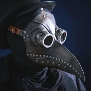 Steampunk raven plague doctor mask in silver finish with adjustable leather strap, distressed metallic rivets, brass goggles, and curved bird beak - left three-quarter view