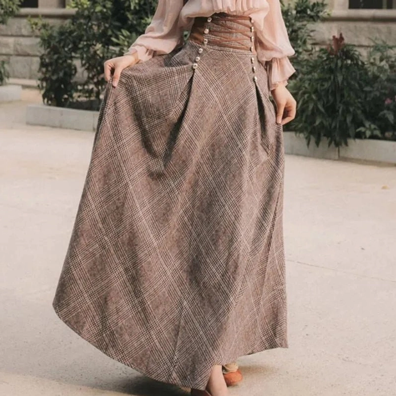 Side profile of high-waisted brown tartan steampunk maxi skirt with flowing hem in vintage garden setting