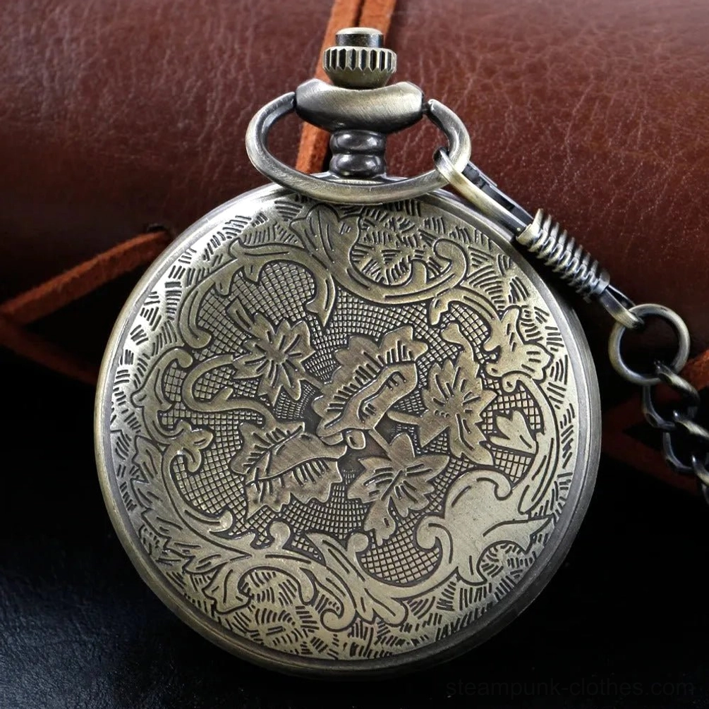 Vintage steampunk pocket watch back cover showcasing ornate floral scroll engraving, intricate metalwork pattern, classic bronze finish texture, and artisanal craftsmanship detail