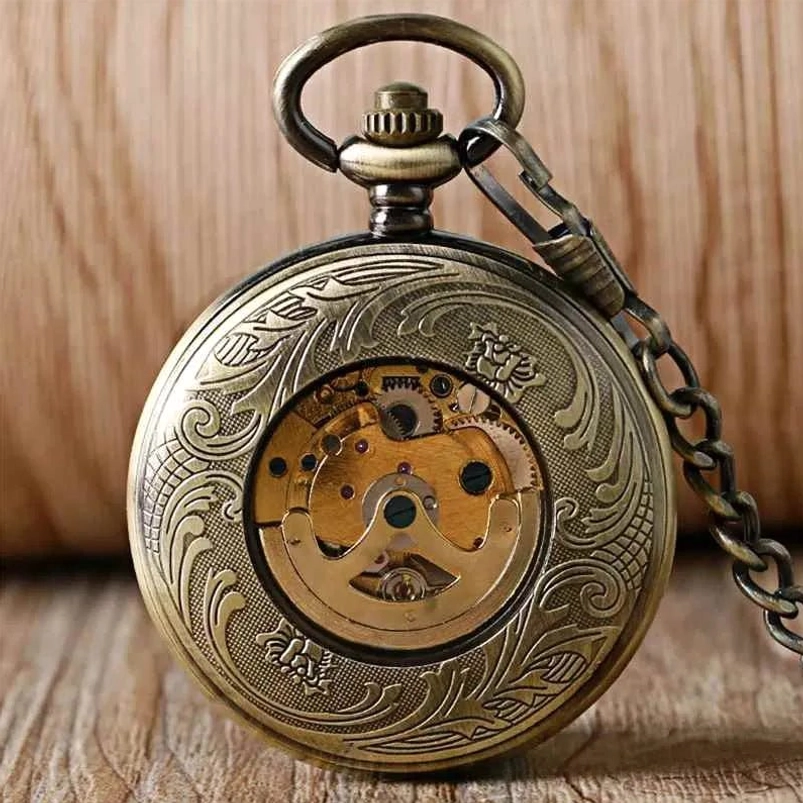 Steampunk pocket watch rear view showing engraved bronze case and exposed skeleton movement through transparent case back