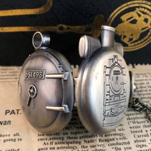 Pair of antique bronze steampunk pocket watches showing back cover with detailed steam locomotive engraving and D51 498 marking