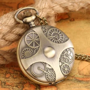 Antique brass steampunk pocket watch with engraved gear cover and attached chain displayed on vintage map backdrop