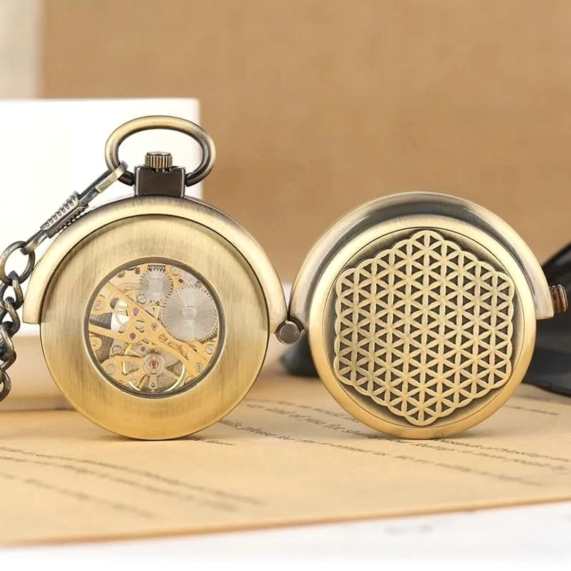 Two bronze steampunk pocket watches displayed flat, showing both closed flower of life engraved cover and open skeleton movement rear