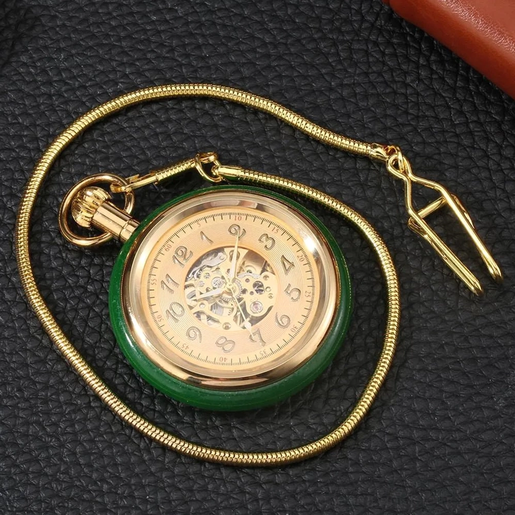 Complete steampunk pocket watch with full chain and clasp, overhead view showing green outer rim and Arabic numeral dial