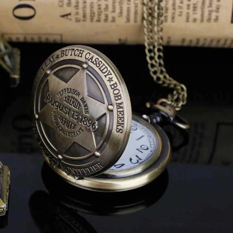 Flip-style steampunk pocket watch in bronze tone with metal chain attachment, partially opened back cover detail view